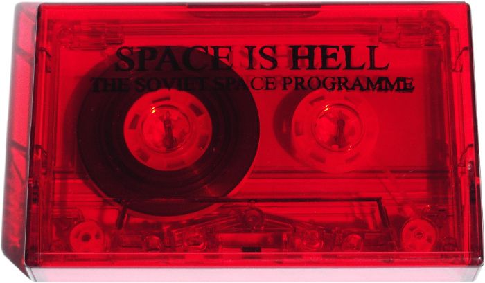 Space Is Hell transparent red cassette in its transparent red box without inlay
